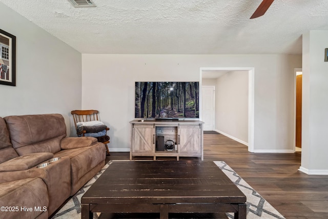 460 S NC-111 Hwy, Chinquapin, NC 28521 - living area with wood finished floors, baseboards, a ceiling fan, and a textured ceiling