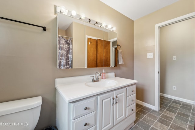 460 S NC-111 Hwy, Chinquapin, NC 28521 - bathroom with vanity, toilet, and baseboards