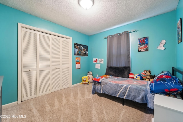 460 S NC-111 Hwy, Chinquapin, NC 28521 - carpeted bedroom with a textured ceiling, a closet, and baseboards