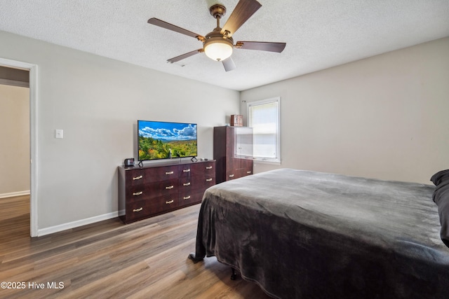 460 S NC-111 Hwy, Chinquapin, NC 28521 - bedroom featuring wood finished floors, baseboards, a textured ceiling, and ceiling fan