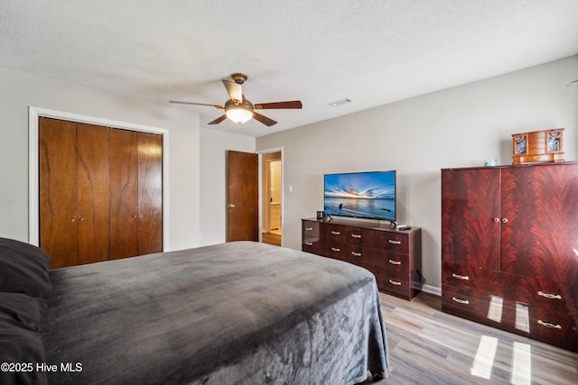 460 S NC-111 Hwy, Chinquapin, NC 28521 - bedroom featuring light wood-style floors, a closet, ceiling fan, and baseboards