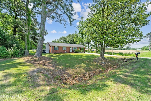 460 S NC-111 Hwy, Chinquapin, NC 28521 - ranch-style home with a front yard and driveway
