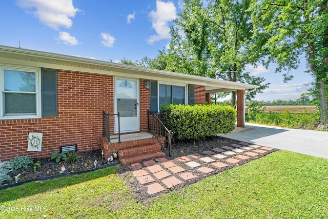 460 S NC-111 Hwy, Chinquapin, NC 28521 - ranch-style home featuring brick siding and a front lawn