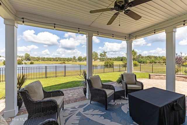 711 Lanyard Dr, Newport, NC 28570 - view of patio with a water view and ceiling fan