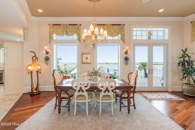 291 Live Oak Rd, Newport, NC 28570 - dining space with wood finished floors, french doors, a chandelier, crown molding, and recessed lighting