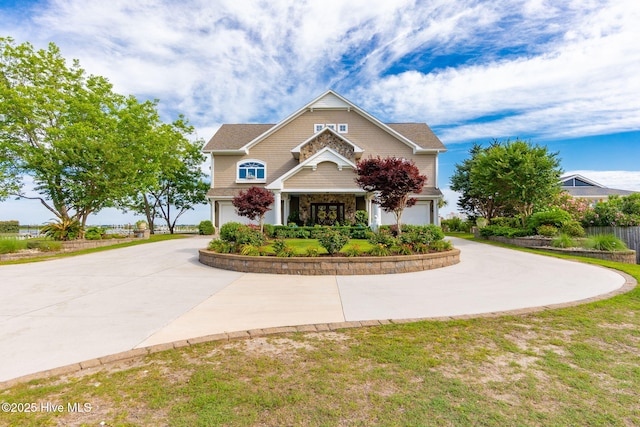 291 Live Oak Rd, Newport, NC 28570 - view of front facade with curved driveway and a garage