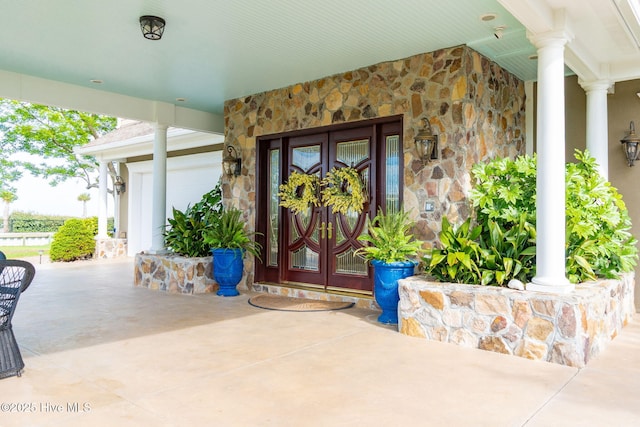 291 Live Oak Rd, Newport, NC 28570 - doorway to property featuring stone siding, french doors, and covered porch