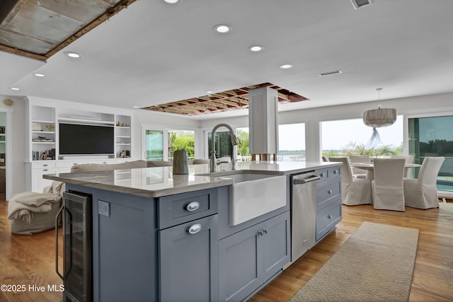 1205 Kings Lndg, Hampstead, NC 28443 - kitchen featuring beverage cooler, a sink, gray cabinets, open floor plan, and recessed lighting