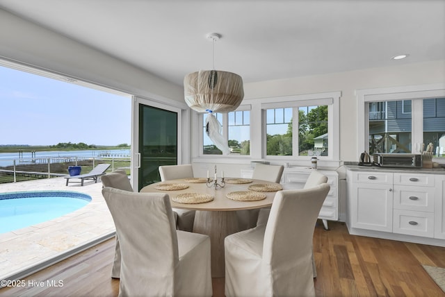 1205 Kings Lndg, Hampstead, NC 28443 - dining area with a water view, wood finished floors, and recessed lighting