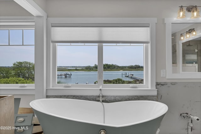 1205 Kings Lndg, Hampstead, NC 28443 - bathroom with a freestanding tub and a water view