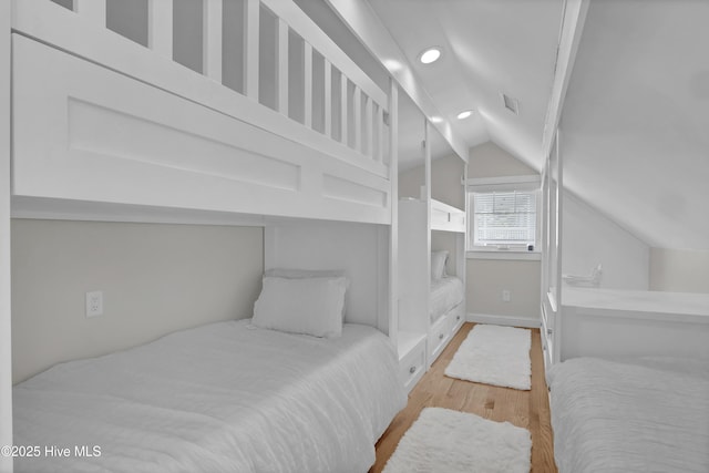 1205 Kings Lndg, Hampstead, NC 28443 - bedroom featuring wood finished floors, vaulted ceiling, recessed lighting, and baseboards