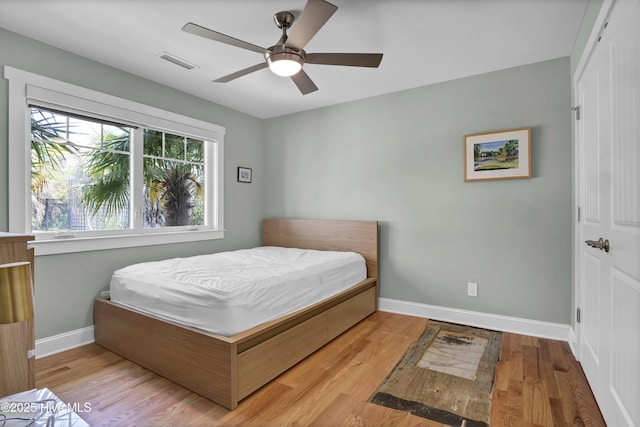 1205 Kings Lndg, Hampstead, NC 28443 - bedroom with baseboards, wood finished floors, and a ceiling fan
