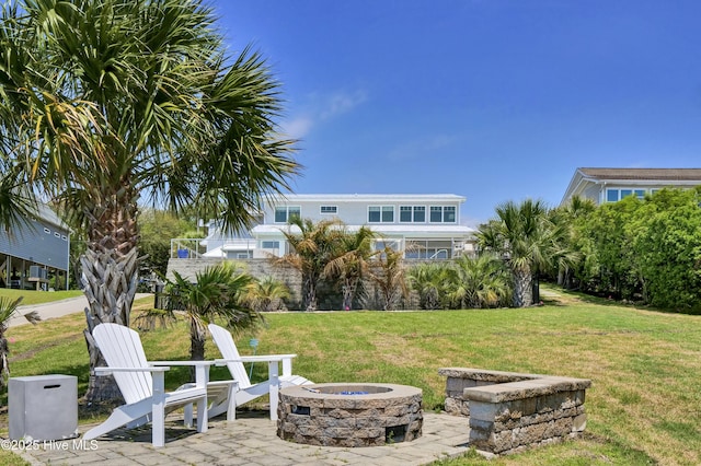 1205 Kings Lndg, Hampstead, NC 28443 - view of grassy yard with a fire pit and a patio area