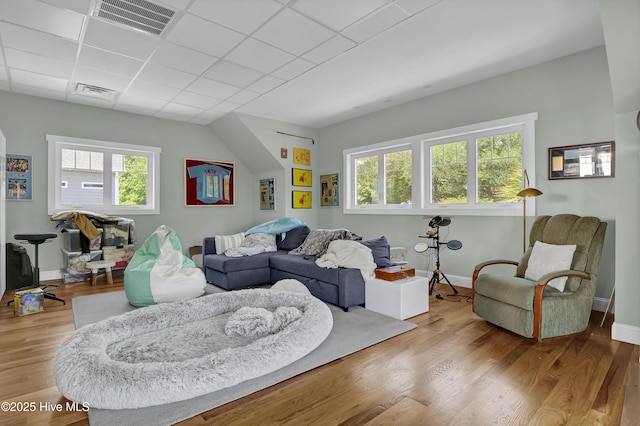 1205 Kings Lndg, Hampstead, NC 28443 - living room featuring wood finished floors, baseboards, and a drop ceiling