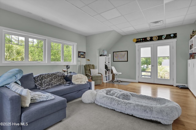1205 Kings Lndg, Hampstead, NC 28443 - living room with wood finished floors, a paneled ceiling, and baseboards
