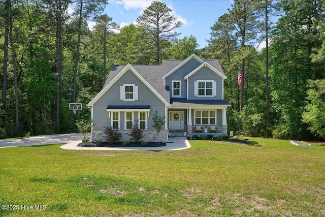 5 Rafferty Ct, Whispering Pines, NC 28327 - craftsman-style house featuring covered porch, a front yard, and a shingled roof