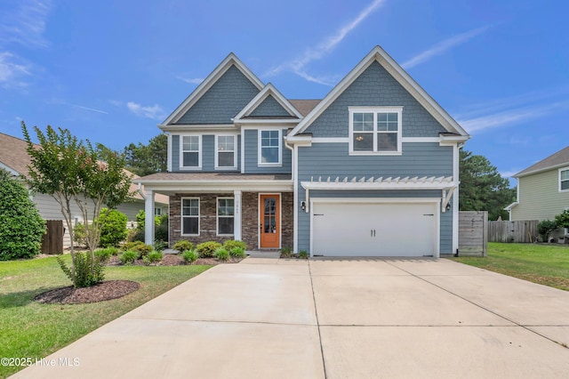 7869 Champlain Dr, Wilmington, NC 28412 - craftsman inspired home with concrete driveway, a garage, covered porch, and stone siding