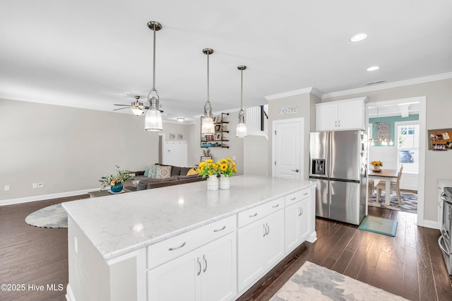7869 Champlain Dr, Wilmington, NC 28412 - kitchen with stainless steel fridge, a center island, dark wood-type flooring, ornamental molding, and open floor plan