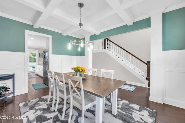 7869 Champlain Dr, Wilmington, NC 28412 - dining area featuring coffered ceiling, beam ceiling, wood-type flooring, wainscoting, and stairway