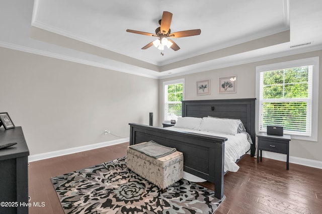 7869 Champlain Dr, Wilmington, NC 28412 - bedroom with a tray ceiling, dark wood finished floors, crown molding, baseboards, and ceiling fan