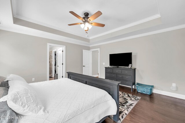 7869 Champlain Dr, Wilmington, NC 28412 - bedroom with a raised ceiling, baseboards, dark wood-type flooring, crown molding, and ceiling fan