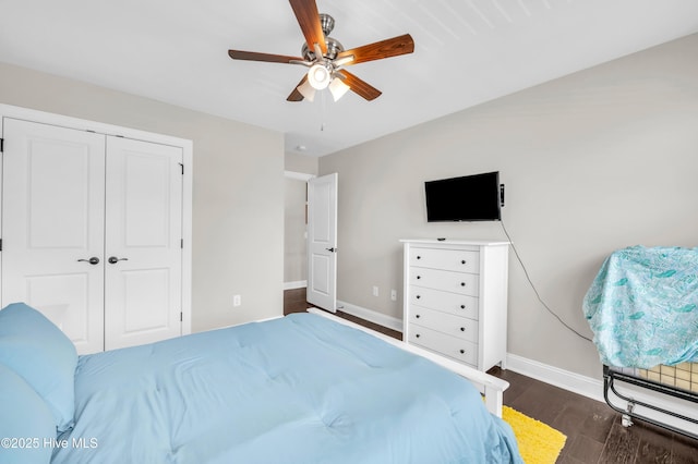7869 Champlain Dr, Wilmington, NC 28412 - bedroom featuring baseboards, dark wood finished floors, a closet, and a ceiling fan