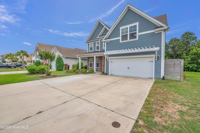 7869 Champlain Dr, Wilmington, NC 28412 - view of front facade featuring driveway, a garage, and a front yard