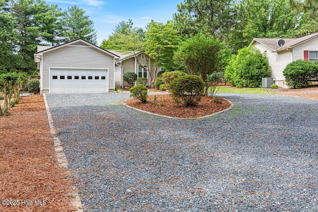 129 Shagbark Ct, West End, NC 27376 - view of front of home with driveway, central AC, and an attached garage
