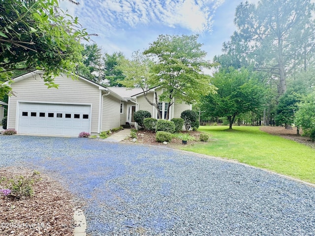 129 Shagbark Ct, Seven Lakes, NC 27376 - view of front of home with asphalt driveway, an attached garage, and a front lawn