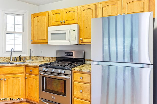 129 Shagbark Ct, Seven Lakes, NC 27376 - kitchen featuring stainless steel appliances and light stone counters