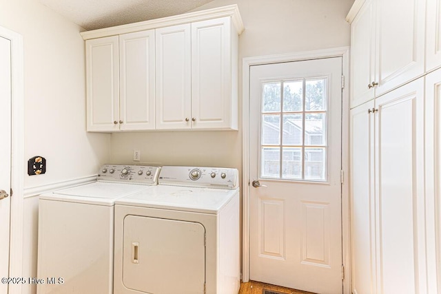 129 Shagbark Ct, Seven Lakes, NC 27376 - laundry room with cabinet space and washer and dryer