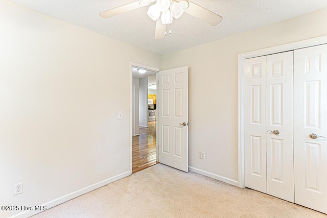 129 Shagbark Ct, Seven Lakes, NC 27376 - unfurnished bedroom featuring light carpet, a closet, and a ceiling fan