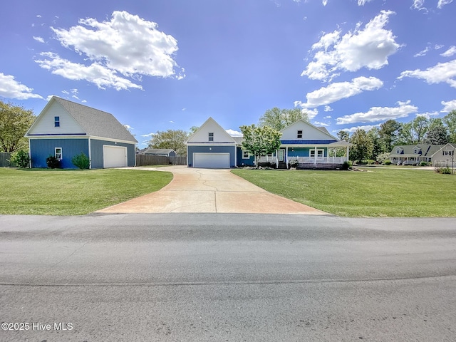 106 Sound Shore Dr, Currituck, NC 27929 - traditional home with concrete driveway and a garage