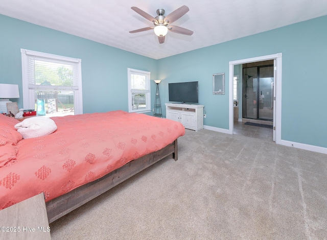 106 Sound Shore Dr, Currituck, NC 27929 - bedroom featuring multiple windows, baseboards, light carpet, and a ceiling fan