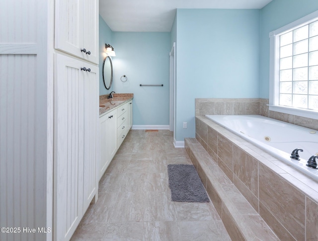 106 Sound Shore Dr, Currituck, NC 27929 - full bath featuring a tub with jets, vanity, tile patterned flooring, and baseboards