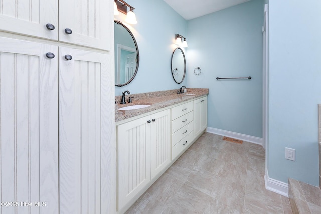 106 Sound Shore Dr, Currituck, NC 27929 - full bath featuring baseboards, double vanity, and tile patterned flooring