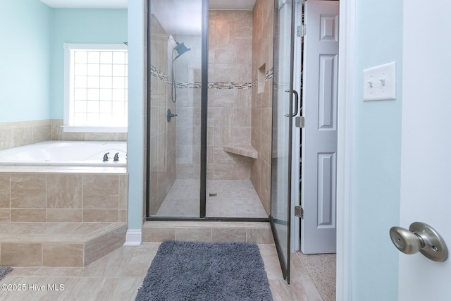 106 Sound Shore Dr, Currituck, NC 27929 - bathroom with a stall shower, a garden tub, and tile patterned floors
