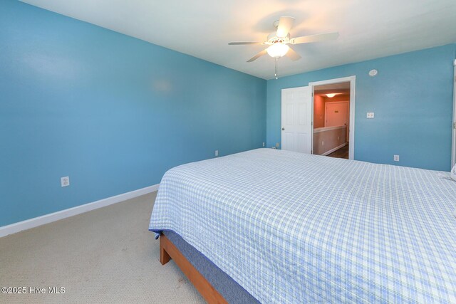 106 Sound Shore Dr, Currituck, NC 27929 - bedroom with carpet flooring, baseboards, and a ceiling fan