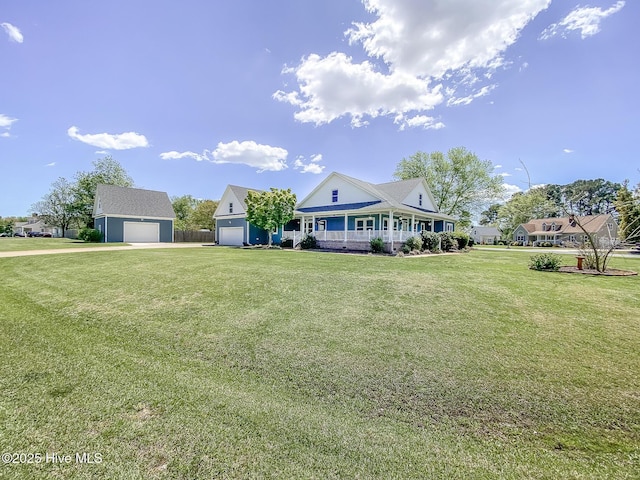 106 Sound Shore Dr, Currituck, NC 27929 - country-style home with covered porch, a front yard, and asphalt driveway
