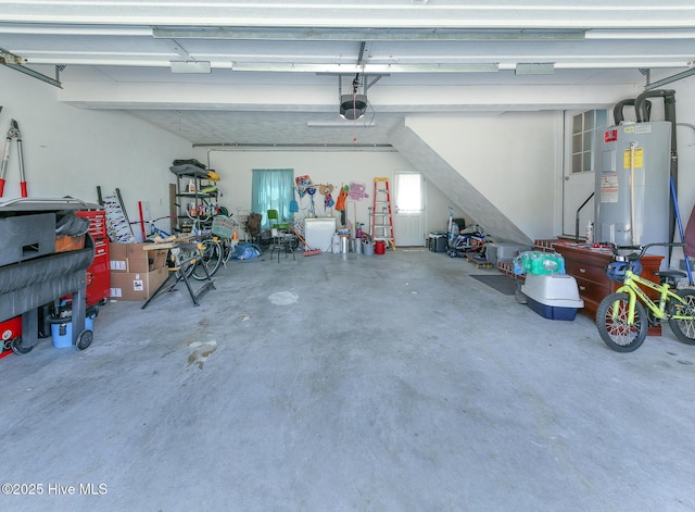 106 Sound Shore Dr, Currituck, NC 27929 - garage with electric water heater and a garage door opener