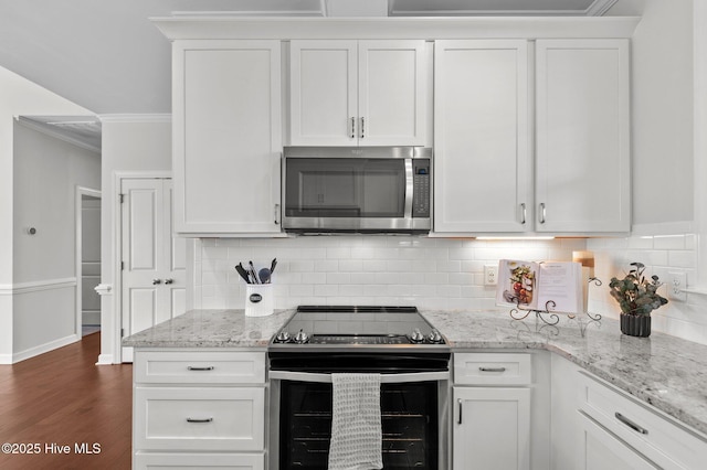 3068 Joe Stocks Rd, Greenville, NC 27858 - kitchen featuring appliances with stainless steel finishes, white cabinets, tasteful backsplash, and crown molding