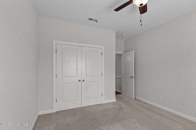 3068 Joe Stocks Rd, Greenville, NC 27858 - unfurnished bedroom with carpet, a closet, baseboards, and a ceiling fan