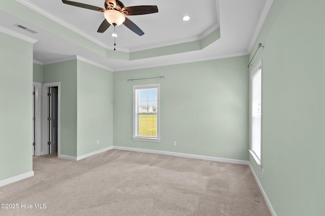 3068 Joe Stocks Rd, Greenville, NC 27858 - spare room with light carpet, a ceiling fan, ornamental molding, a tray ceiling, and baseboards