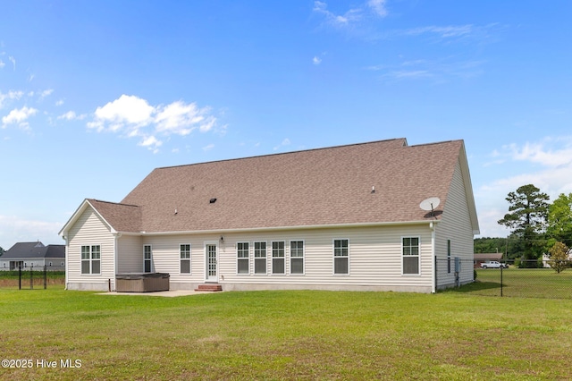 3068 Joe Stocks Rd, Greenville, NC 27858 - back of property with a hot tub, a patio area, and a shingled roof