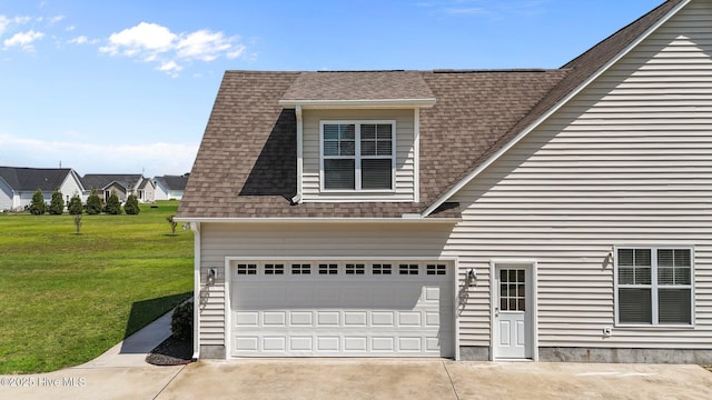 3068 Joe Stocks Rd, Greenville, NC 27858 - view of home's exterior with a shingled roof, a yard, concrete driveway, and a garage