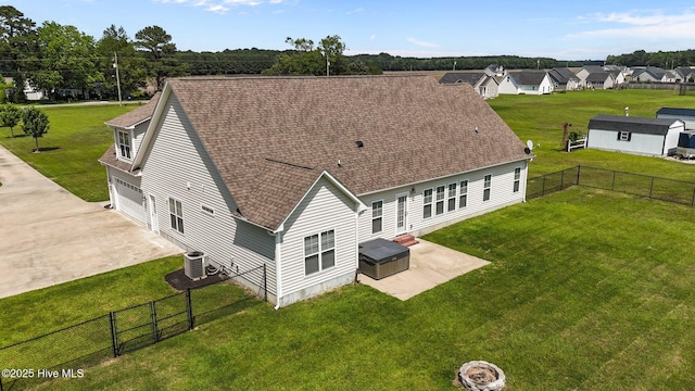 3068 Joe Stocks Rd, Greenville, NC 27858 - rear view of house with a garage, cooling unit, driveway, a shingled roof, and a patio