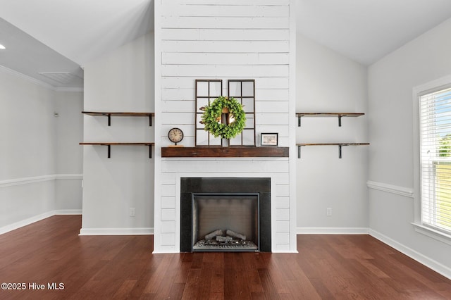 3068 Joe Stocks Rd, Greenville, NC 27858 - unfurnished living room with vaulted ceiling, wood finished floors, plenty of natural light, and a fireplace