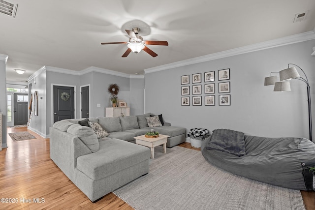 456 N Prince Henry Way, Cameron, NC 28326 - living room with light wood-style flooring, ceiling fan, ornamental molding, and baseboards