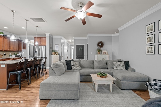 456 N Prince Henry Way, Cameron, NC 28326 - living area featuring ceiling fan, light wood-style floors, ornamental molding, and recessed lighting