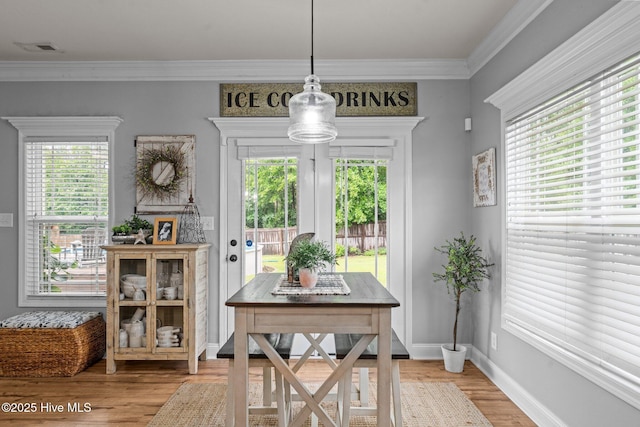 456 N Prince Henry Way, Cameron, NC 28326 - dining space featuring healthy amount of natural light, wood finished floors, ornamental molding, and baseboards